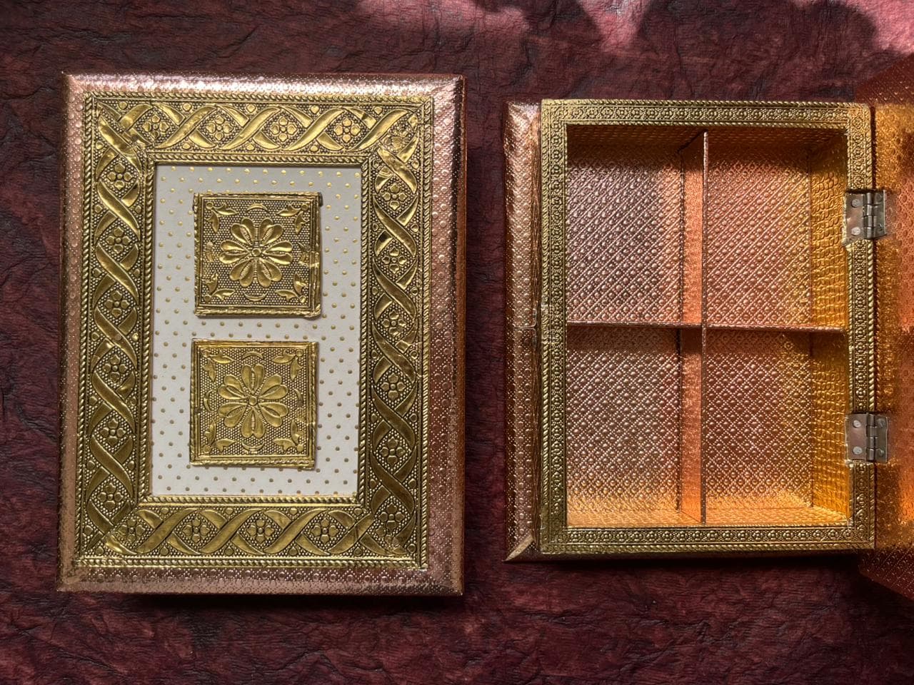 Open decorative Rakhi gift box with four empty compartments