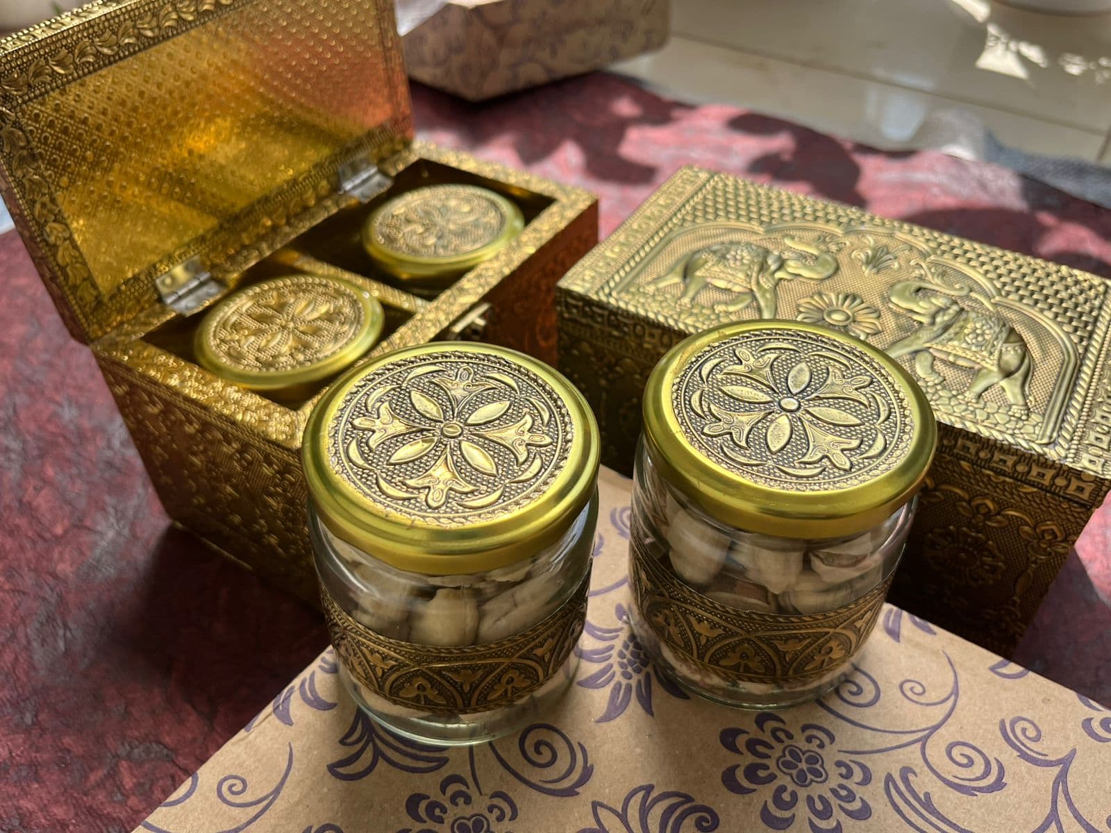 Ornate Raksha Bandhan dry fruit gift boxes with cashews and festive gold detailing