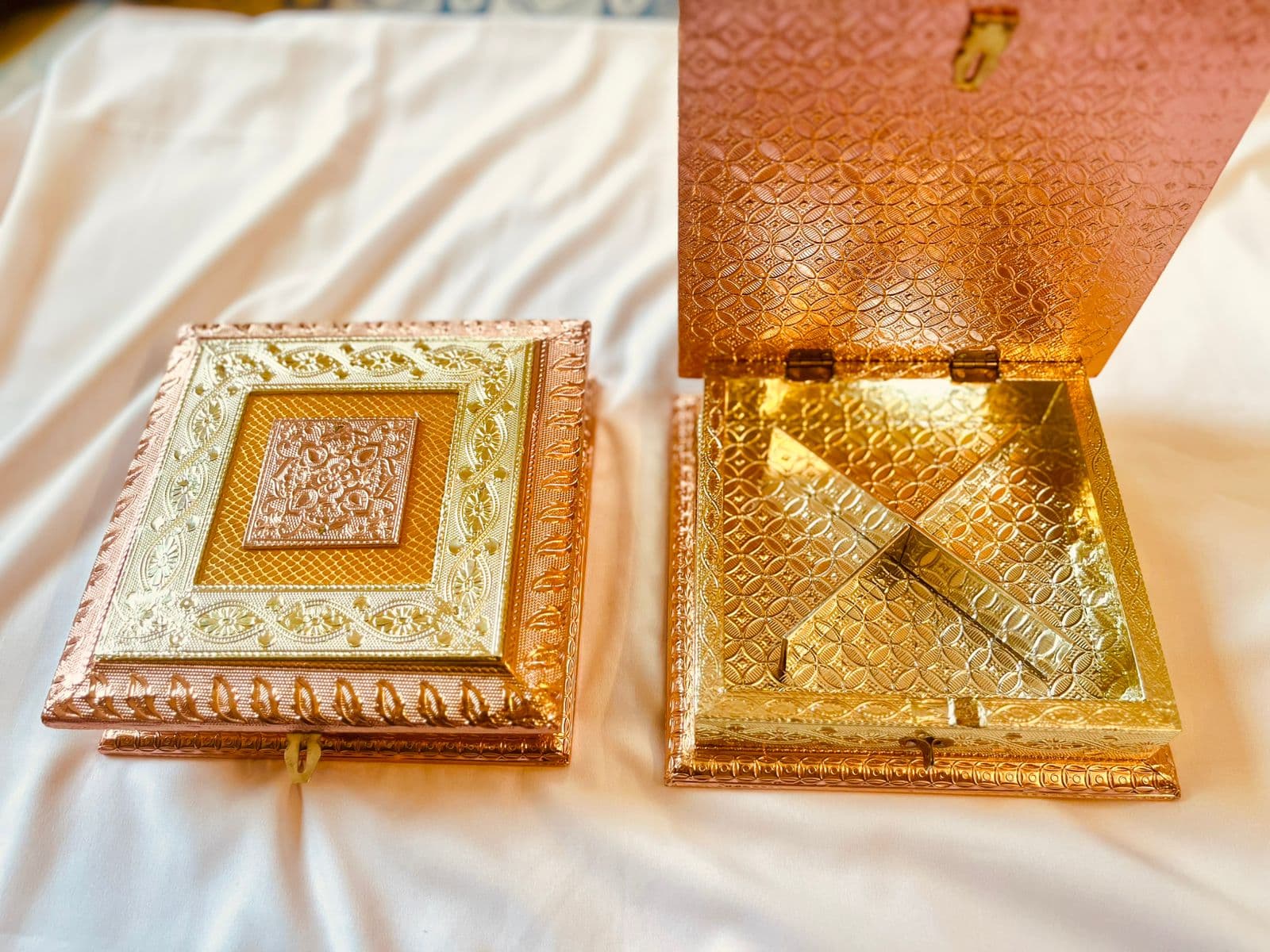 Open decorative Rakhi gift box with compartments ready for a dry fruit assortment